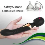Black Dual Head Vibrator resting across a hand beside the supplier's material-comparison graphic