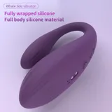 Purple Whale tide vibrator with a curved two-arm body, ridged surface, power button and two charging contacts
