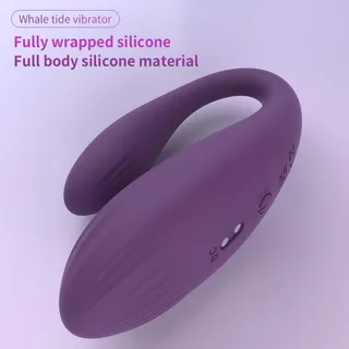 Purple Whale tide vibrator with a curved two-arm body, ridged surface, power button and two charging contacts