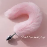 Pink faux fur tail attached to a silver-coloured tapered plug on a pink background, labelled Pink tail anal plug